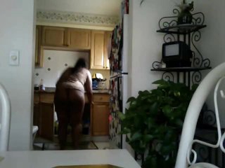 Black chick does the dishes in pants